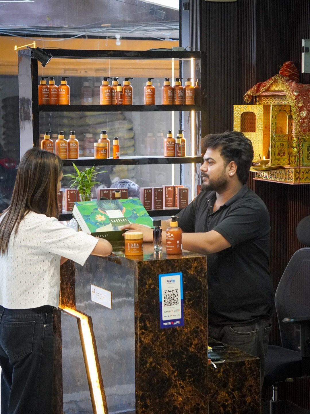 Professional hair consultation and premium product display at Music Salon