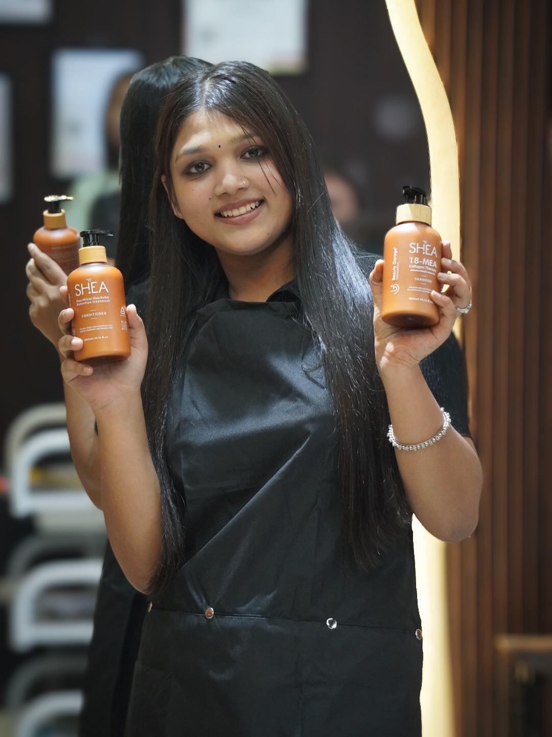 Happy client with professional hair care products at Music Salon Mandi